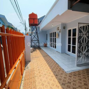 rumah strategis bagus uda renovasi jln 2 mobil lebih garasi 2 bebas banjir dekat